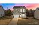 Charming two-story home with green siding, a front porch, and a well-manicured lawn at 922 Houston Heights Rd, Charlotte, NC 28262