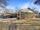 House with a spacious covered patio and a flat backyard at 1005 Woodland Dr, Gastonia, NC 28054