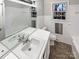 Updated bathroom with a vanity and a bathtub at 1005 Woodland Dr, Gastonia, NC 28054
