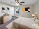 Virtually staged bedroom with ceiling fan and neutral decor at 1005 Woodland Dr, Gastonia, NC 28054