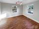 Dining room with hardwood floors and a chandelier at 1005 Woodland Dr, Gastonia, NC 28054