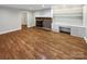 Gathering room with hardwood floors, fireplace, and built-in shelves at 1005 Woodland Dr, Gastonia, NC 28054