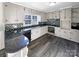 Renovated kitchen with granite countertops and modern appliances at 1005 Woodland Dr, Gastonia, NC 28054