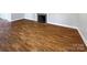 Living room featuring hardwood floors and a fireplace at 1005 Woodland Dr, Gastonia, NC 28054
