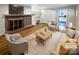 Virtually staged living room with fireplace and hardwood floors at 1005 Woodland Dr, Gastonia, NC 28054