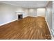 Spacious living room with hardwood floors and fireplace at 1005 Woodland Dr, Gastonia, NC 28054