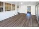 Bright sunroom with wood-look flooring and access to outdoors at 1005 Woodland Dr, Gastonia, NC 28054