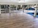 Sunroom with wood-look flooring and sliding glass doors at 1005 Woodland Dr, Gastonia, NC 28054