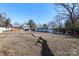 Large backyard with detached garage and additional storage structures at 1024 Queens Rd, Charlotte, NC 28207