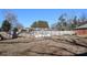 Side yard with wooden fence and several large bags at 1024 Queens Rd, Charlotte, NC 28207