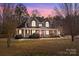 Brick two-story house with large windows, front porch, and landscaping at 105 Bayridge Dr, Salisbury, NC 28146