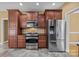 Modern kitchen with stainless steel appliances and dark wood cabinets at 105 Bayridge Dr, Salisbury, NC 28146