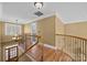 Upstairs hallway with hardwood floors and wrought iron railing at 105 Bayridge Dr, Salisbury, NC 28146