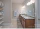Double vanity bathroom with granite countertops and large mirror at 1361 Colwick Ln, Rock Hill, SC 29732