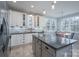 Modern kitchen with white cabinets, granite countertops, and a large island at 1361 Colwick Ln, Rock Hill, SC 29732
