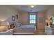 Comfortable bedroom with neutral decor, a plush bed, and plenty of natural light from the window at 1381 6Th Ne St, Hickory, NC 28601
