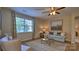 Cozy living room featuring a ceiling fan, large window, and comfortable seating with stylish decor at 1381 6Th Ne St, Hickory, NC 28601