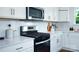 Close-up of a well-equipped kitchen with modern appliances, sleek countertops, and ample storage space at 1386 6Th Ne St, Hickory, NC 28601