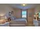 Bright bedroom with striped bedding and a window at 1389 6Th Ne St, Hickory, NC 28601