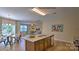 Open kitchen with granite island, stainless steel appliances, and breakfast bar at 1389 6Th Ne St, Hickory, NC 28601
