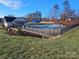 Community pool with a surrounding fence and landscaping at 1389 6Th Ne St, Hickory, NC 28601