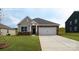 Charming single-story home featuring a two-car garage, stone accents, and a well-manicured lawn at 1400 6Th Ne St, Hickory, NC 28601