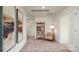 Hallway featuring decorative art and a cozy seating area with a stylish bookshelf at 1427 5Th Street Ne Dr, Hickory, NC 28601