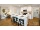 Modern open kitchen featuring white cabinets, stainless steel appliances, and a large kitchen island at 1427 5Th Street Ne Dr, Hickory, NC 28601
