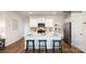 Modern kitchen with white cabinets, stainless steel appliances, and a spacious island with seating at 1427 5Th Street Ne Dr, Hickory, NC 28601