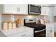 Stylish kitchen featuring stainless steel appliances, white cabinetry, and white countertops at 1427 5Th Street Ne Dr, Hickory, NC 28601