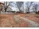 Large backyard with a brick patio and trees at 1505 S Ridge Ave, Kannapolis, NC 28083