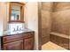 Bathroom with dark vanity and shower stall at 1505 S Ridge Ave, Kannapolis, NC 28083