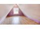 Purple and wood-look floor bedroom with a window at 1505 S Ridge Ave, Kannapolis, NC 28083
