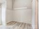 Simple bedroom with wood-look flooring and neutral walls at 1505 S Ridge Ave, Kannapolis, NC 28083