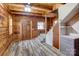 Spacious entryway with exposed beams, wood walls, and stairs to the upper level at 1505 S Ridge Ave, Kannapolis, NC 28083