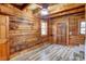 Open and airy entryway with wood walls and flooring, and exposed beams at 1505 S Ridge Ave, Kannapolis, NC 28083