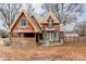 Two-story home with wood siding and metal roof at 1505 S Ridge Ave, Kannapolis, NC 28083