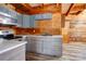 Modern galley kitchen with gray cabinets, stainless steel appliances, and wood accents at 1505 S Ridge Ave, Kannapolis, NC 28083