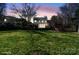 View of a home's backyard with a lush lawn and privacy fence, perfect for outdoor gatherings and relaxation at 212 Catalina Dr, Mooresville, NC 28117