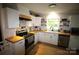 Modern kitchen featuring butcher block countertops, stainless steel appliances, and white shaker cabinets at 2982 Brady Hoffman Rd, Lincolnton, NC 28092