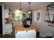 Modern kitchen with white cabinets, butcher block countertops, and an island with seating at 2982 Brady Hoffman Rd, Lincolnton, NC 28092