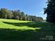 Spacious grassy lot with surrounding trees at 304 Tradition Dr, Mount Gilead, NC 27306