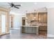 Open kitchen features a large island and stainless steel appliances at 304 Tradition Dr, Mount Gilead, NC 27306