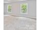 Spacious bedroom with plush carpeting and large windows at 305 Saddlewood Dr, Gastonia, NC 28056