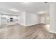 Open concept kitchen with white cabinets and granite countertops at 305 Saddlewood Dr, Gastonia, NC 28056