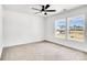 Spacious bedroom with large windows and ceiling fan at 3070 Swallowtail Ln, Kannapolis, NC 28027