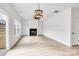 Living room with hardwood floors, fireplace, and sliding glass doors at 3070 Swallowtail Ln, Kannapolis, NC 28027