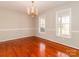 Bright dining room features hardwood floors, chandelier, and large windows at 315 Harvard Dr, Albemarle, NC 28001