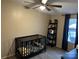 bedroom with crib and shelving unit at 32139 Blakley Dr, Albemarle, NC 28001