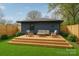 Inviting backyard deck with stylish outdoor furniture, perfect for relaxing and entertaining in a private setting at 531 Manhasset Rd, Charlotte, NC 28209